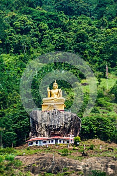 Buddha statue at a hill slope near Aluvihare Rock Temple, Sri Lan