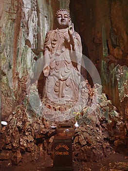 Buddha statue inside cave at Marble mountain in Da Nang, Vietnam