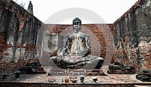Buddha statue inside Wat Wora Chet Tha Ram, a Buddhist temple of archaeological park, Ayutthaya