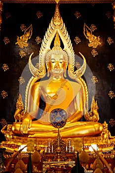 The Buddha statue is located indoors.