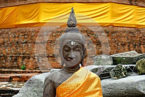 The Buddha statue is located outdoors.