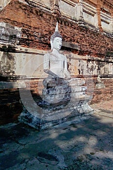 The Buddha statue is located outdoors.