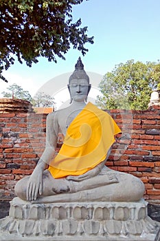 The Buddha statue is located outdoors.