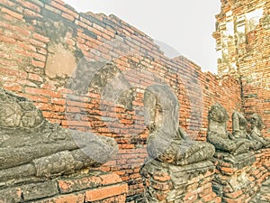 Buddha statue no head Wat Chaiwatthanaram temple in Ayuthaya Historical Park, a UNESCO world heritage site in Thailand
