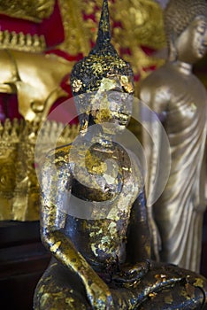 Buddha statue in one of the temples of Thailand.