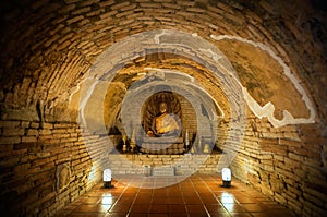 Buddha statue in one of the underground tunnels at Wat Umong, Chiang Mai, Thailand