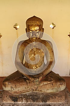 Buddha statue at Pha That Luang Stupa, Vientiane photo