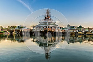 Buddha statue and reflection on water at Buddhamonthon, in Phra