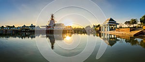 Buddha statue and reflection on water at Buddhamonthon, in Phra