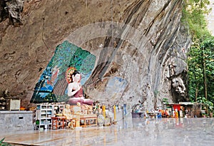 Buddha statue in a rock in the ancient forest