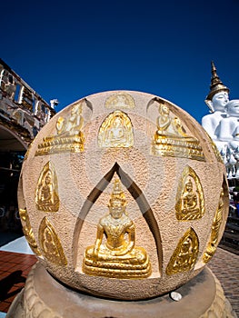 Buddha Statue Sits in The Brown Ball Stone