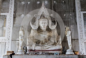 Buddha Statue wrapped in cellophane in buddhist temple under construction