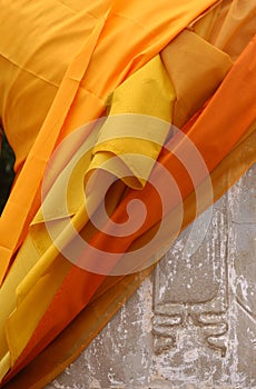 Buddha Statue Wrapped in Orange Fabric