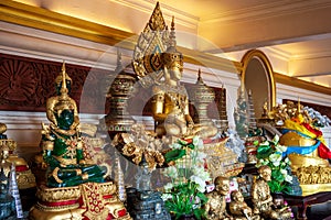 Buddha statues on the altar inside the phu khao thong or golden mountain of wat saket, A landmark of Bangkok Thailand