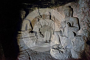 Buddha statues in cave temple hinyana Pandav caves first century BC photo