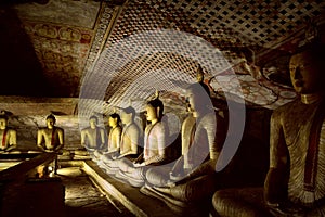 Buddha statues in Dhyana Mudra position in Dambulla photo