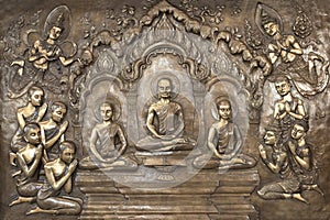 Buddha statues on temple wall in Thailand