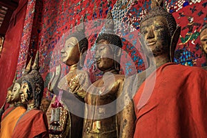 Buddha statues at the Wat Xieng Thong temple in Luang Prabang