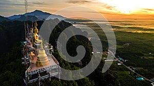 Buddha on the top Mountain of Wat Tham Seua Tiger Cae , Krabi,Thailand