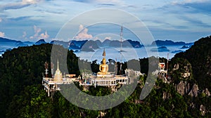 Buddha on the top Mountain of Wat Tham Seua Tiger Cae , Krabi,Thailand photo