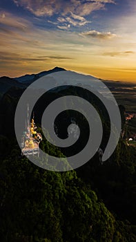 Buddha on the top Mountain of Wat Tham Seua Tiger Cae , Krabi,Thailand photo