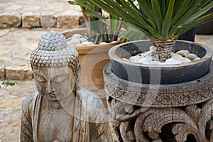 Buddha welcoming the tourist on a terrace