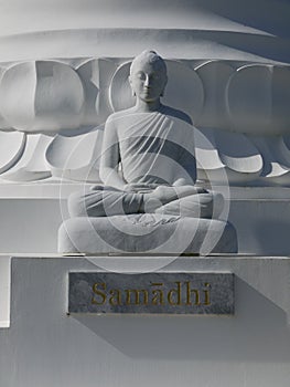 Buddha: white stone figure meditating v