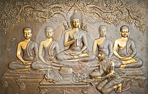 Buddha wooden carving.Mural paintings tell the story about the Buddha`s history