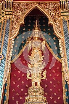 Buddhanarumitr Buddha image statue, replicating King Rama II, enshrined in Thai styled golden chariot movable throne in front of photo