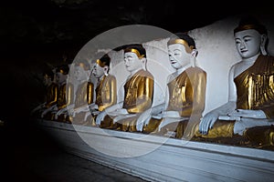 Buddhas in a Cave in Myanmar photo