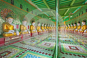 Buddhas and wall in temple, Sagaing hill photo