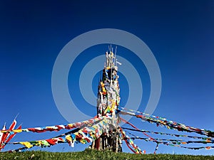 Buddhism colorful prayer flags symbol od spirtualof Tibetan  on the mountain with blue sky