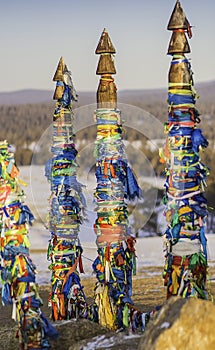 Buddhism ritual shaman pillars symbols in Cape Burhan,Baikal, Russia.