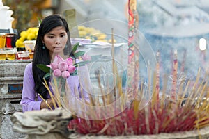 Buddhist Asian woman praying