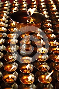 Buddhist butter lamps photo