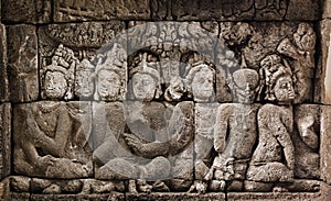 Buddhist carved relief at medieval Borobudur temple on Java, Ind