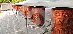 Buddhist Copper prayer drum Sarnath stock