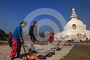 Buddhist devotees do religious rituals in front of the World peace pagoda