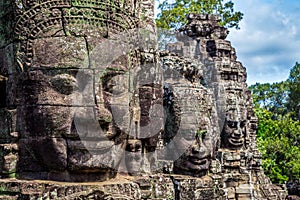 Buddhist faces on towers at Bayon Temple, Cambodia photo
