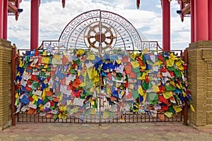 Buddhist flags at the gate of the Buddhist temple complex The Golden Abode of the Buddha Shakyamuni in Elista, Russ