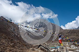 Buddhist flags over small lodge in Nepal