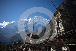 Buddhist gompa and prayer flags in the Himalaya mountains, Annapurna region, Nepal