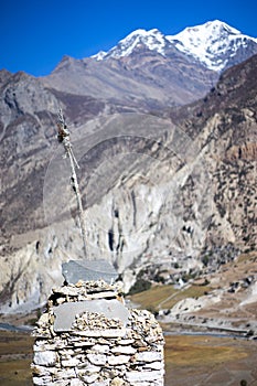Buddhist gompa and prayer flags in the Himalaya mountains, Annapurna region, Nepal