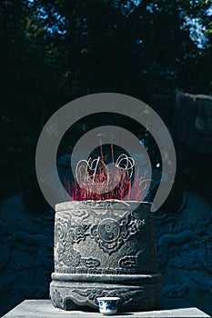 Buddhist Incense Burning infront of a Vietnamese Buddhist Temple