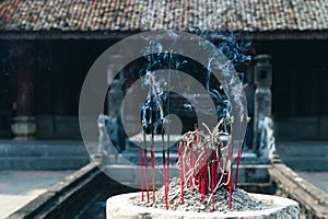 Buddhist Incense Burning infront of a Vietnamese Buddhist Temple