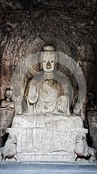 Buddhist Longmen Caves or Dragons Gate Grottoes, Louyang, Henan, China are one of the finest examples of Chinese Buddhist art, ho