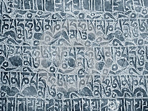 Buddhist mantra carved in stone