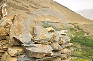 Buddhist mantra and statue carved on stones in Ladakh, INDIA