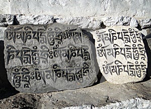 Buddhist mantras Om Manne Padme Hum engraved in stones