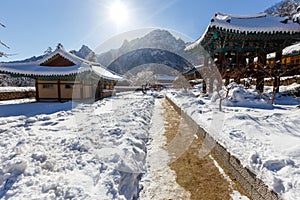 Buddhist monastery among the snowy forest in the winter taiga. Beautiful and uninhabited